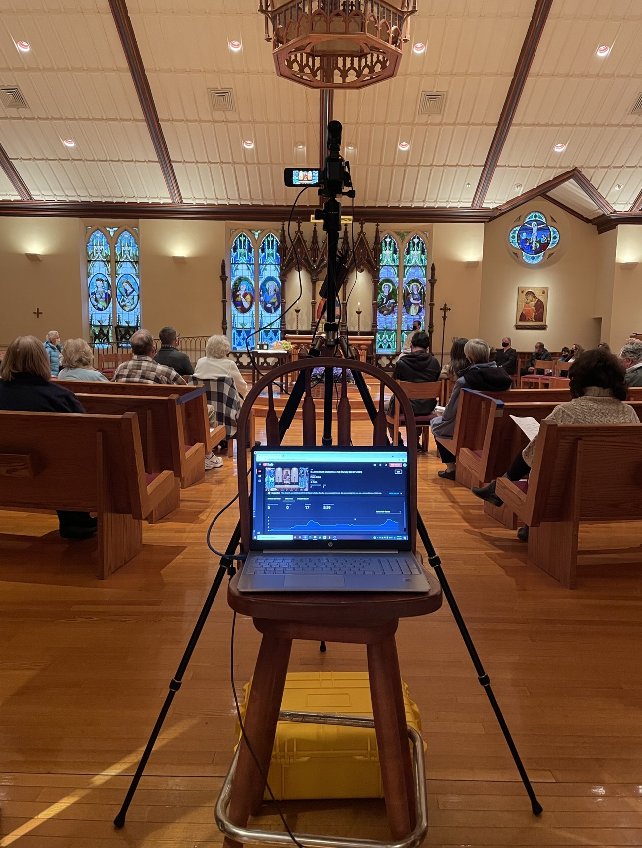 A picture of Aaron at one of his jobs livestreaming a church mass.